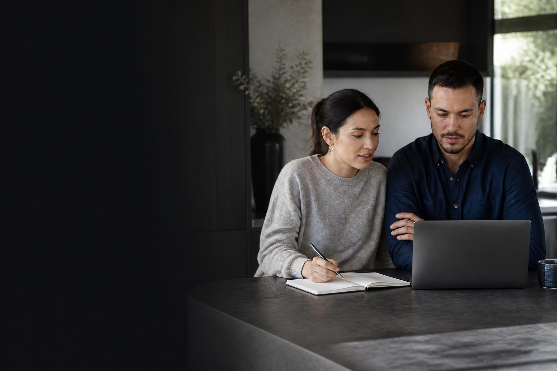 Australian couple planning their finances together in a modern home