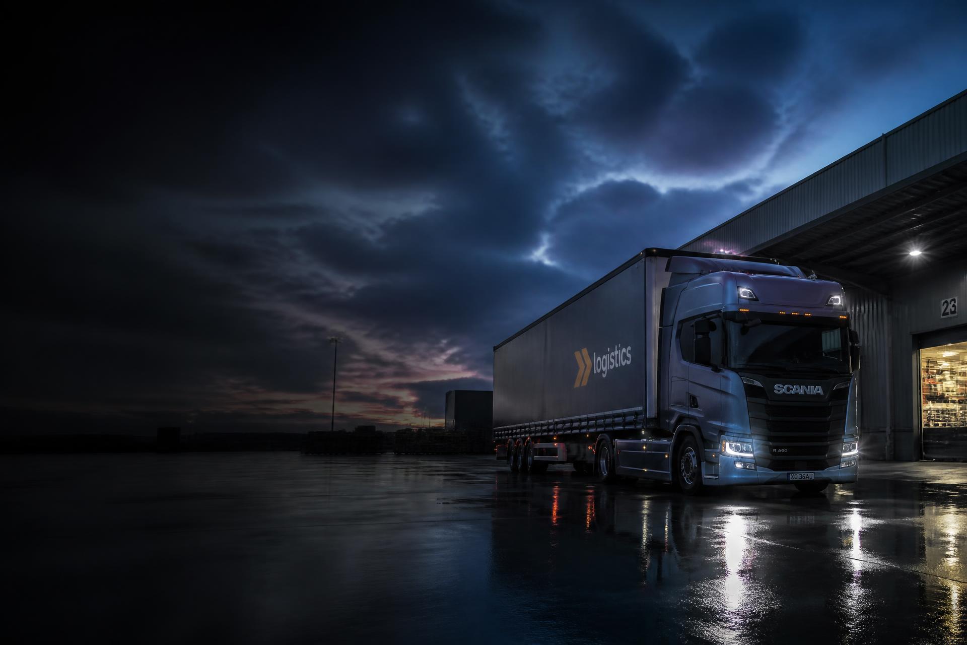 Prime mover and trailer at an Australian logistics depot at dusk